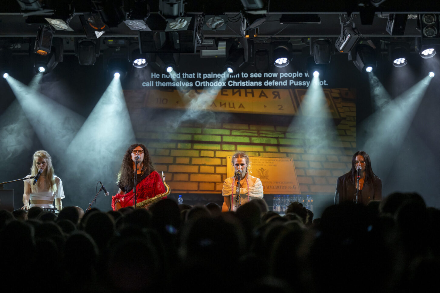 Russian political activists and members of the group Pussy Riot Diana Burkot, Anton Ponomarev, Masha Alyokhina and Olga Borisova, from left, perform on stage during a concert at the Kaserne in Basel, Switzerland, on Tuesday, June 14, 2022. (KEYSTONE/Georgios Kefalas)